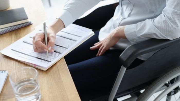 employee in wheelchair working